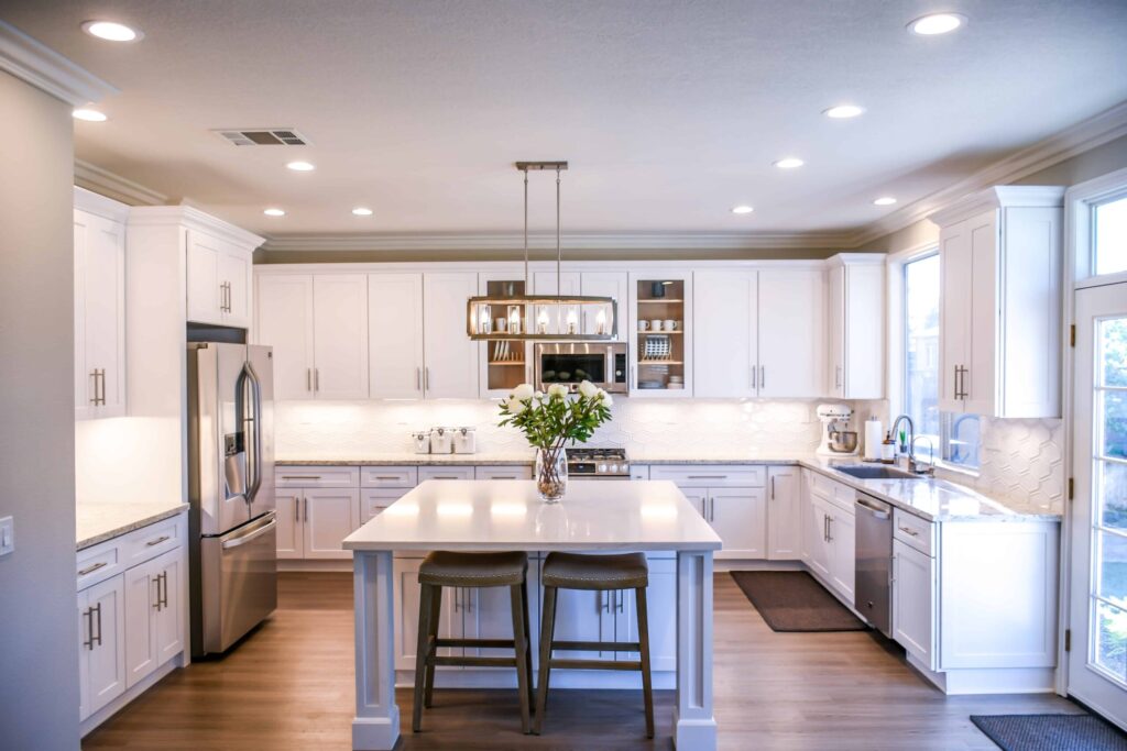 photo shows gorgeous white and open kitchen 