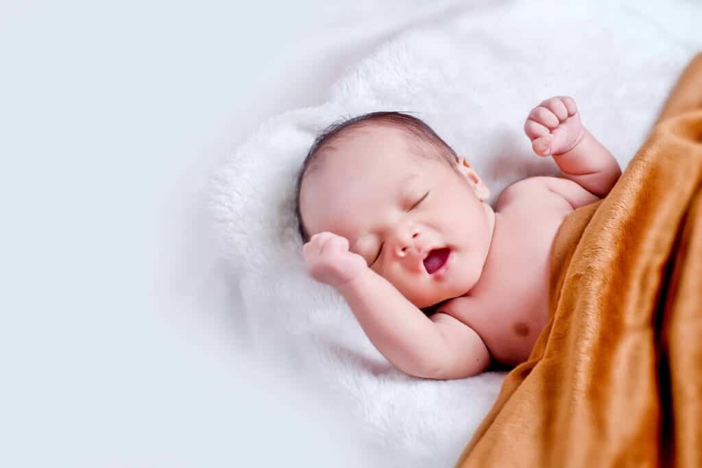 Photo of baby lying on blanket