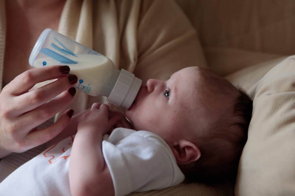 bottle feeding a baby