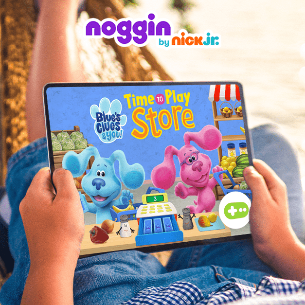 Digital graphic showcasing Nick Jr.'s Blues Clues on an app held by a child