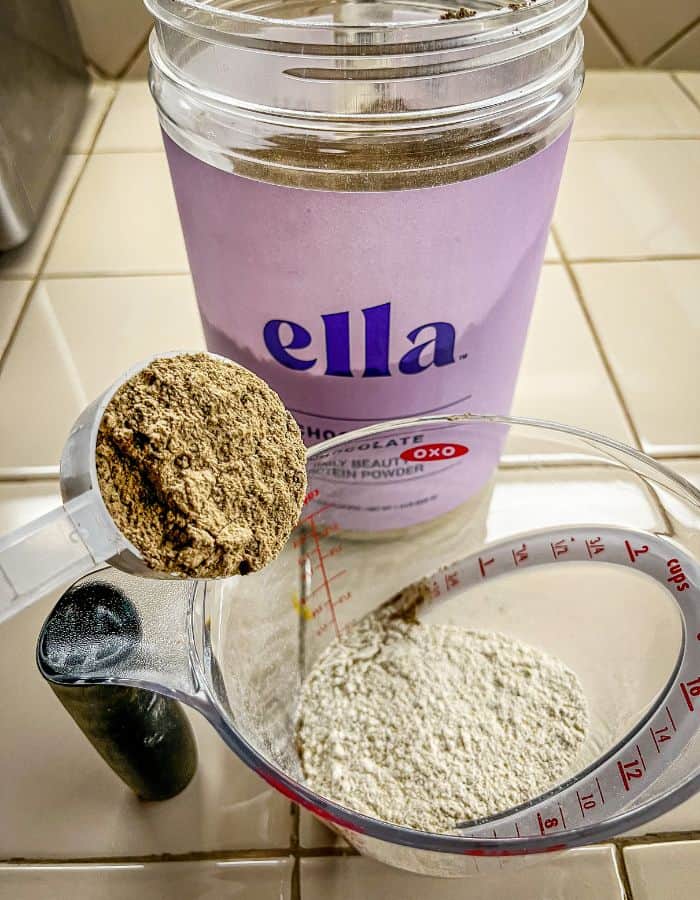 collagen protein shake pancake recipe of the dry ingredients being mixed together in a measuring cup