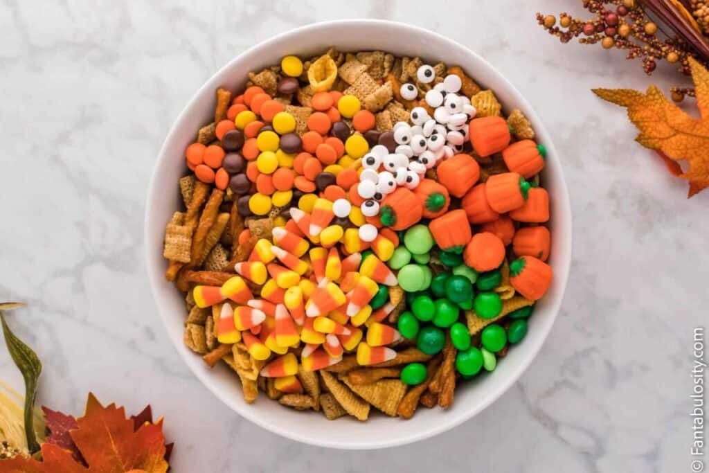 This image shows a flatlay display of halloween snack mix in a bowl