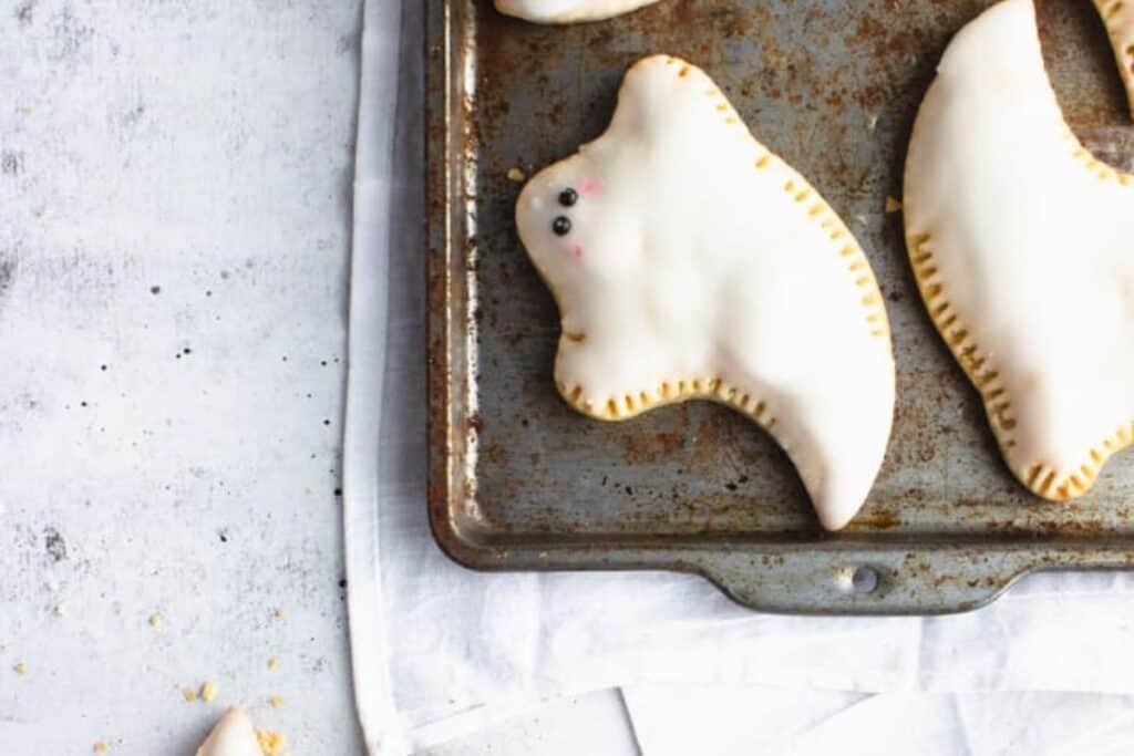 This image shows a flat lay view of a cookie sheet with the poptart ghosts on them 