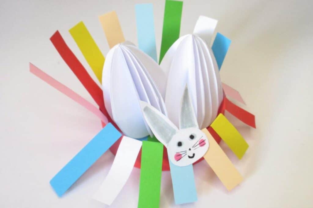 Image of an Easter Egg Nest kid's craft with colorful papers made by The Purple Yarn