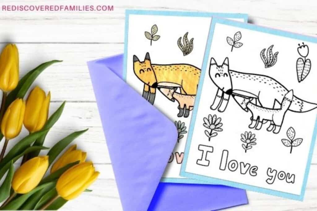 flatlay display of printable mother's day coloring pages next to yellow flowers and a neon purple envelope