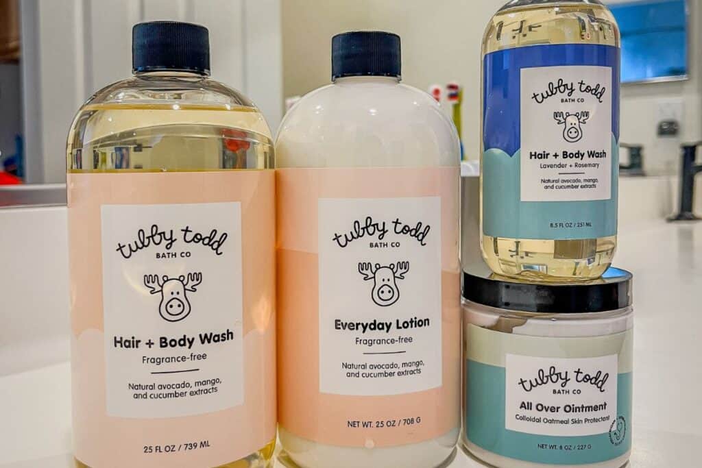 image of Tubby Todd bath + hair wash, lotion, and all over ointment on a white bathroom counter