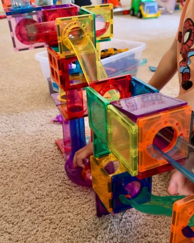 picasso tile marble run built by kids on carpet