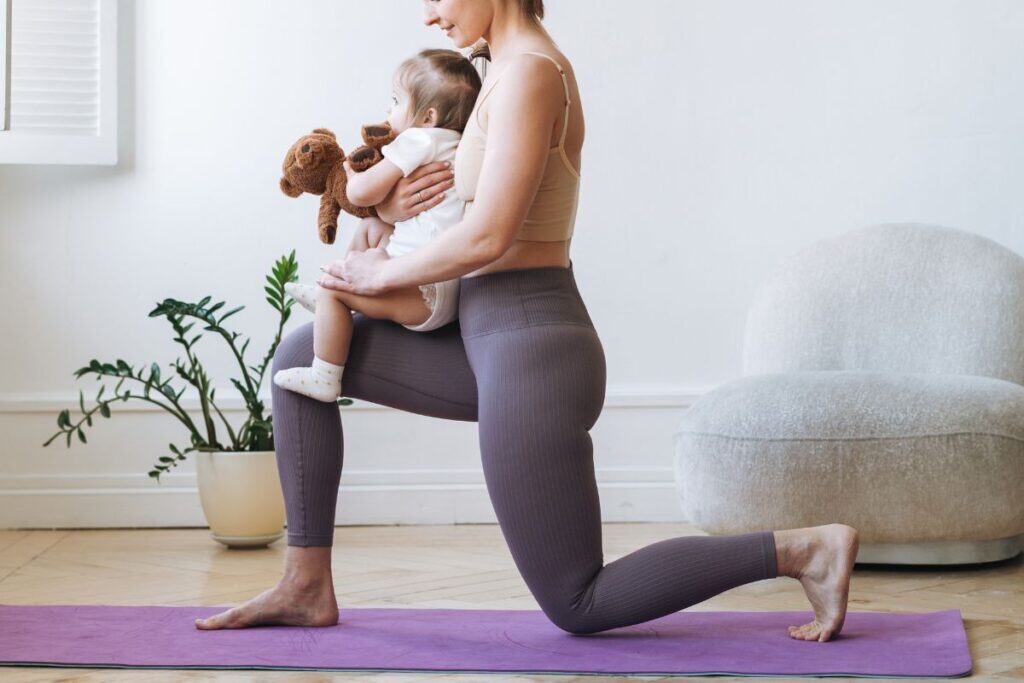 Canva image of a woman doing lunges on a purple yoga mat while holding a baby