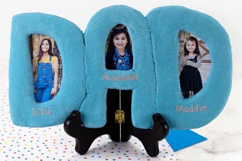 Blue salt dough photo frame made in the shape of the letters D-A-D