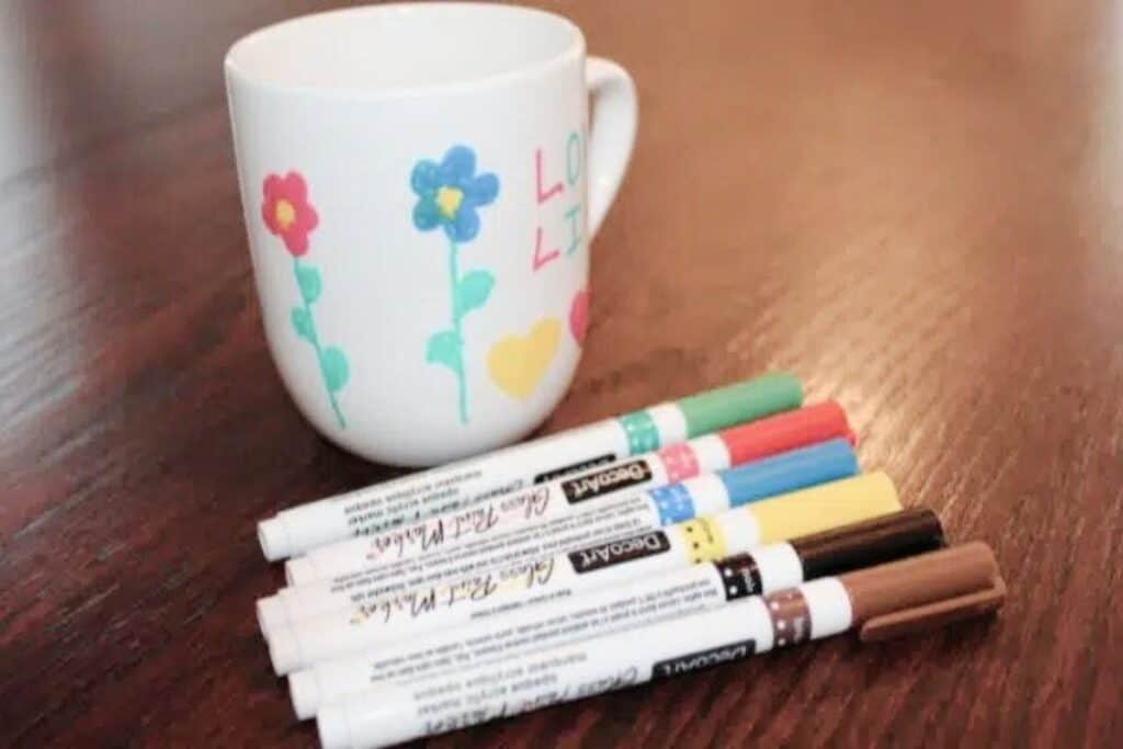 father's day ceramic mug with markers and flowers