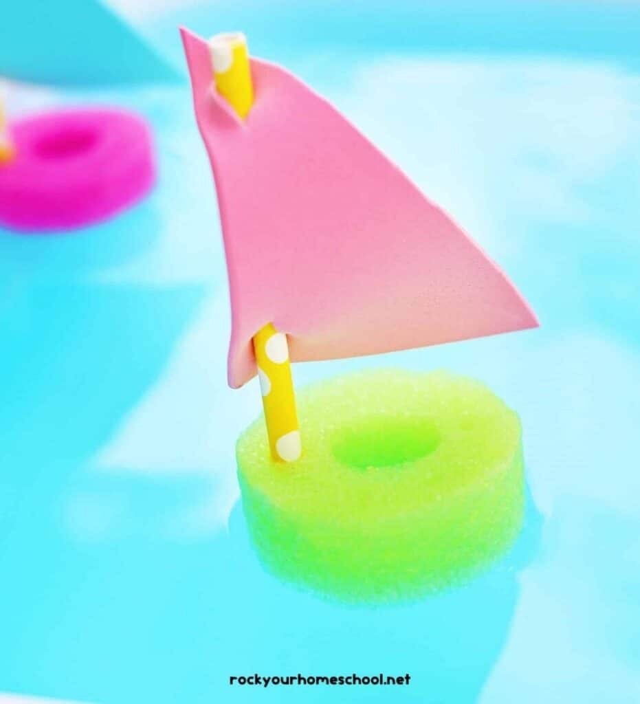 Close up image of a green pool noodle boat - a water play activity for kids