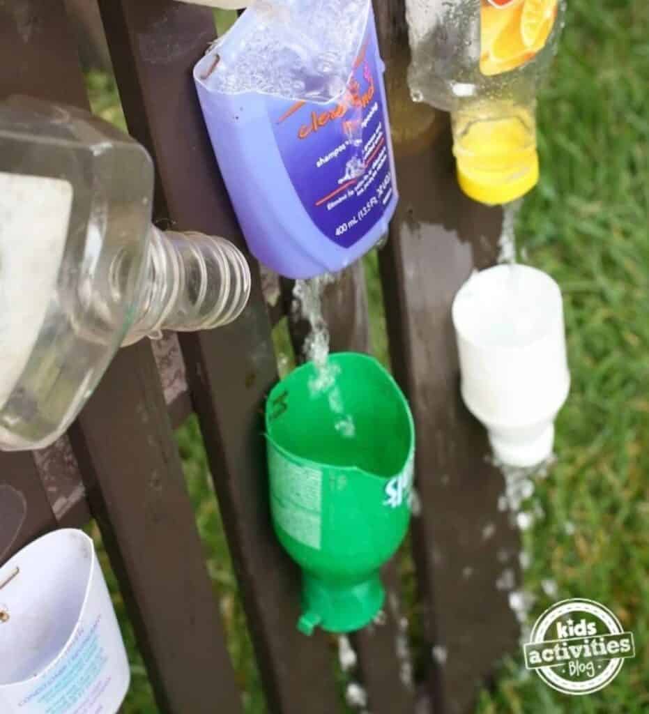close up image of a DIY Water Wall activity put together against a brown fence