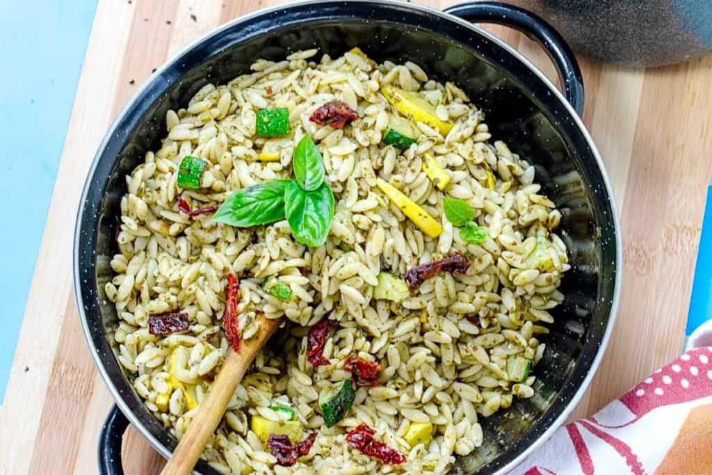 Orzo recipe in a pot with herbs 