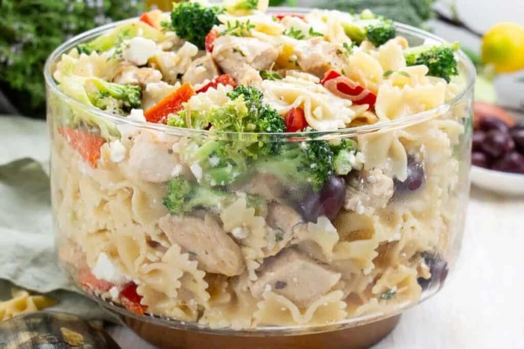 Broccoli and chicken pasta salad in a glass bowl