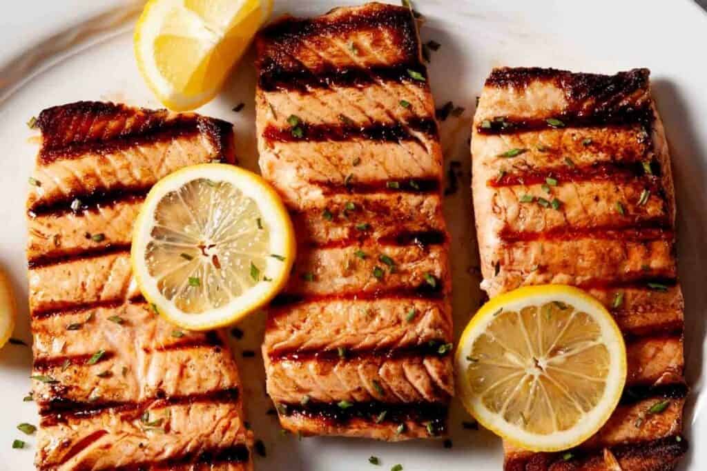 Grilled salmon on a plate with lemon slices