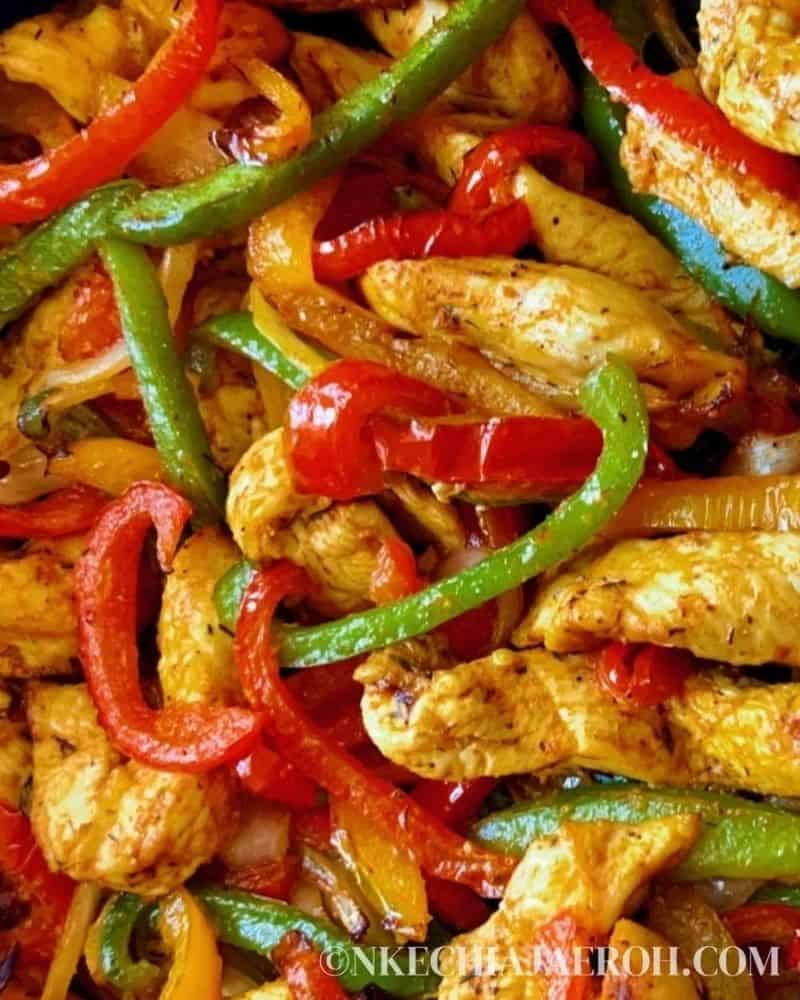 close up image of chicken fajitas and bell peppers