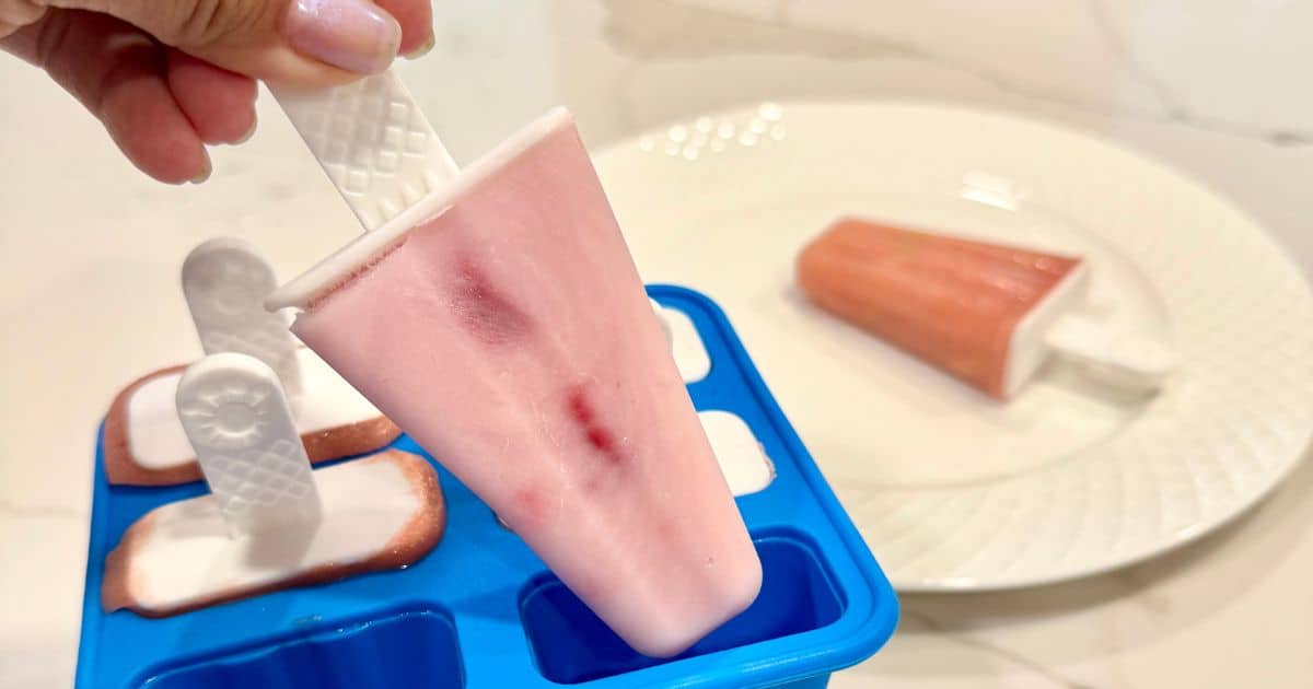 strawberry popsicles in blue ice pop mold