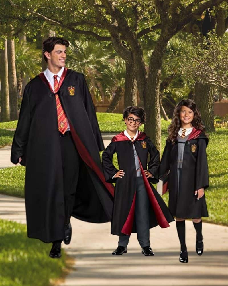 Man and 2 kids dressed up as Harry potter wizards for halloween