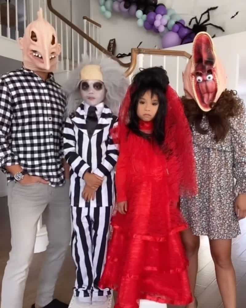 family of 4 dressed in beetlejuice characters for halloween