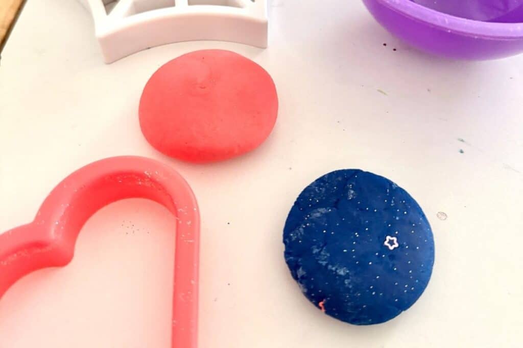 homemade playdough without cream of tartar next to some playdough molds