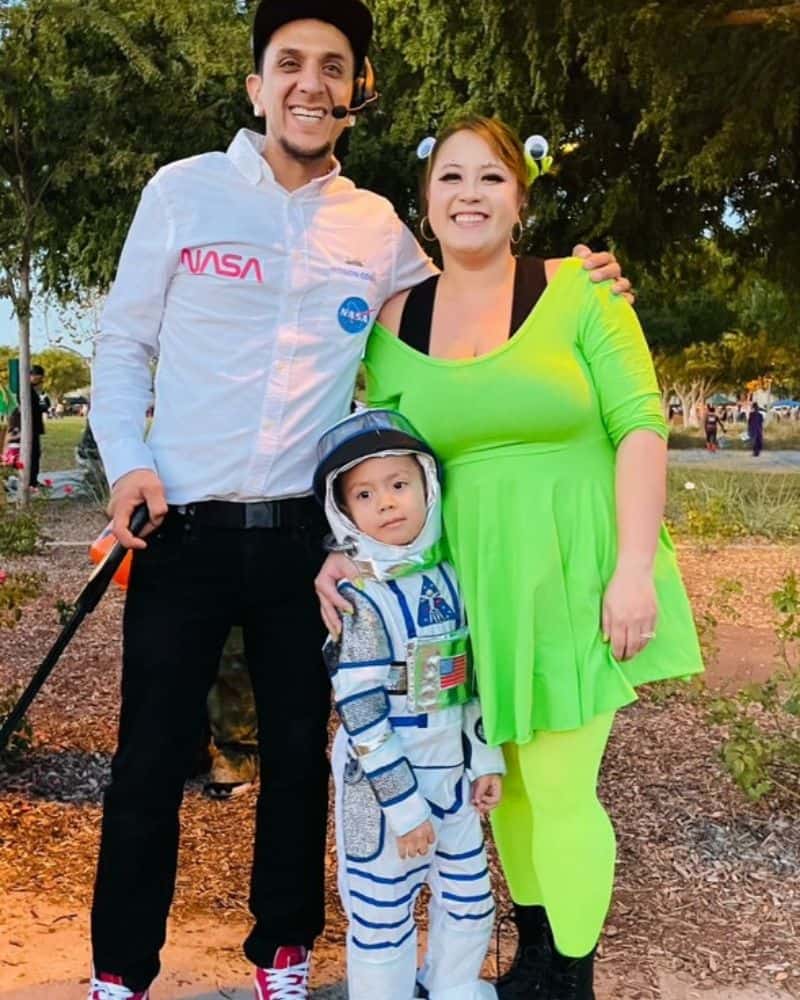 Family of 3 dressed as a Nasa worker, astronaut, and green alien.