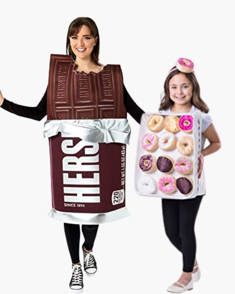 2 girls dressed in candy halloween costumes