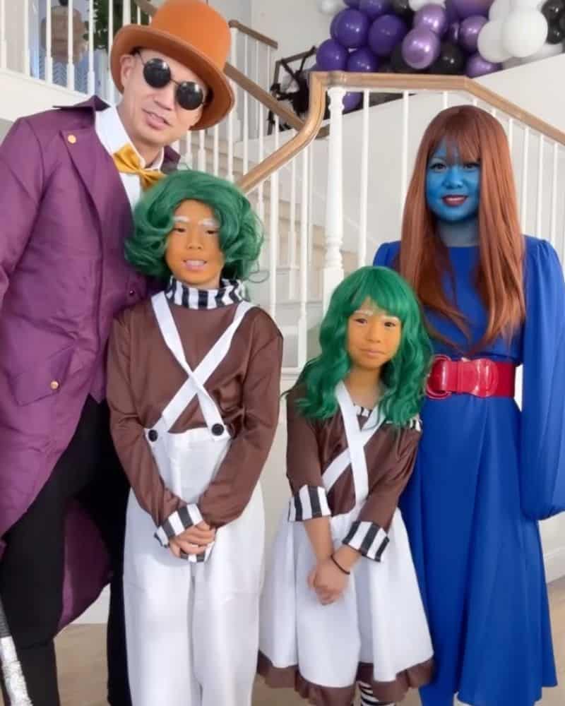 Family of 4 dressed up as Willy Wonka characters for halloween