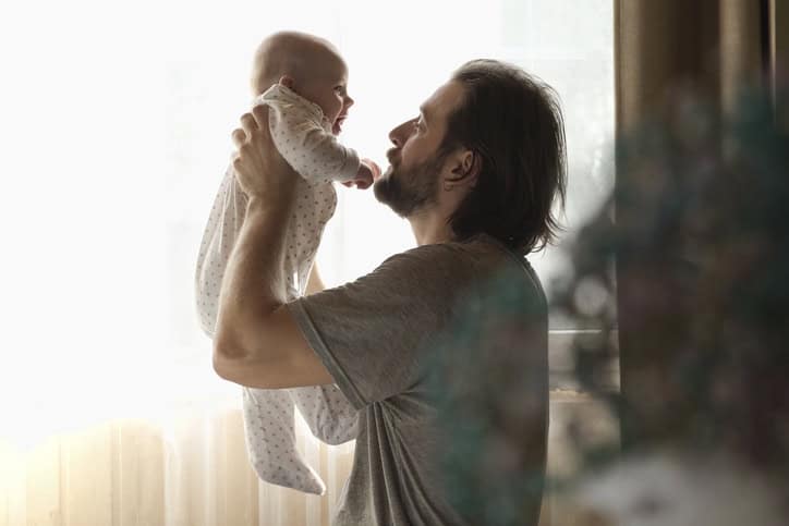 Father holding new baby