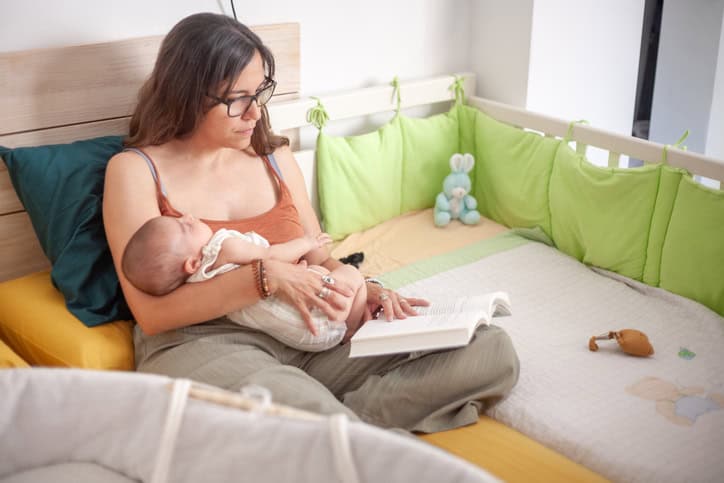 Calm mother holding her new baby