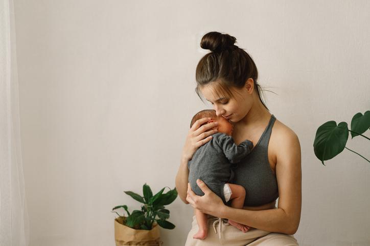 mother holding baby
